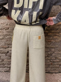 Sunset Pants Yellow de Bipikau de espaldas: pantalón ancho de rayas amarillo claro con la Cactus Tee Grey
