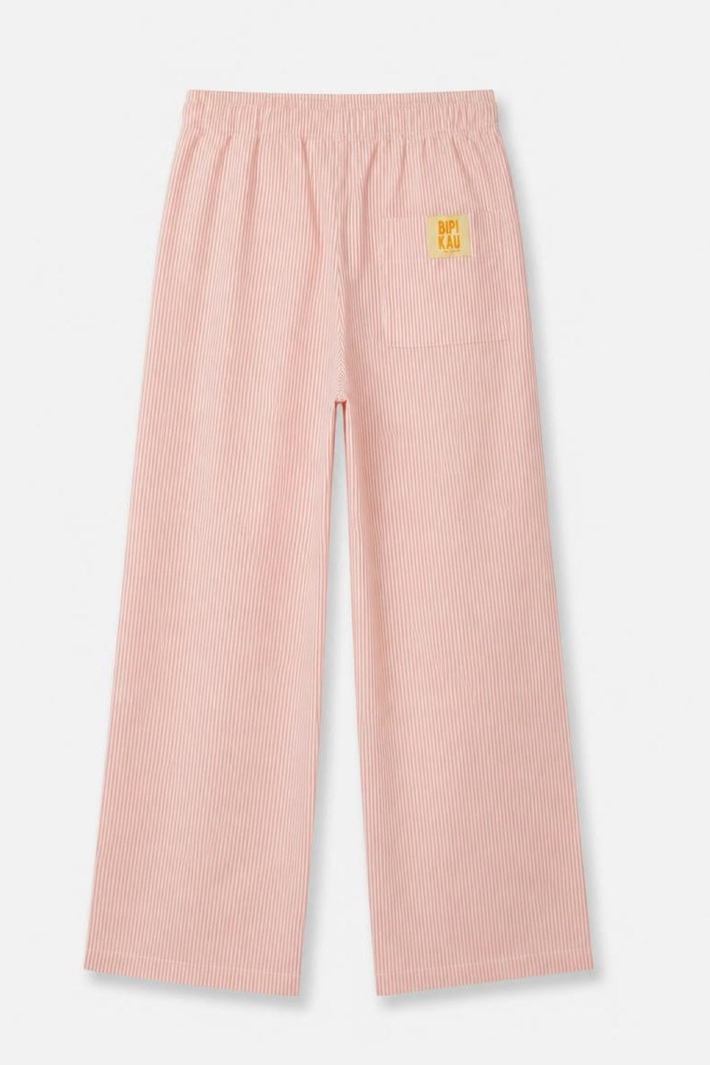 Parte trasera de los Sunset Pants Orange de Bipikau sobre fondo blanco, con la etiqueta amarilla en el bolsillo